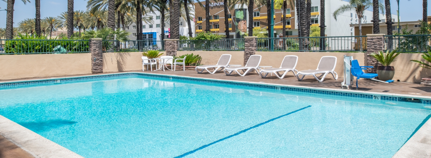 RELAX BESIDE THE POOL AFTER A FUN DAY OF EXPLORING SOUTHERN CALIFORNIA